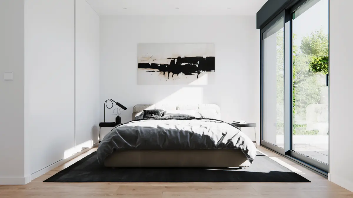 Dormitorio principal luminoso de una vivienda modular de 160 m² con ventanal y acceso al exterior